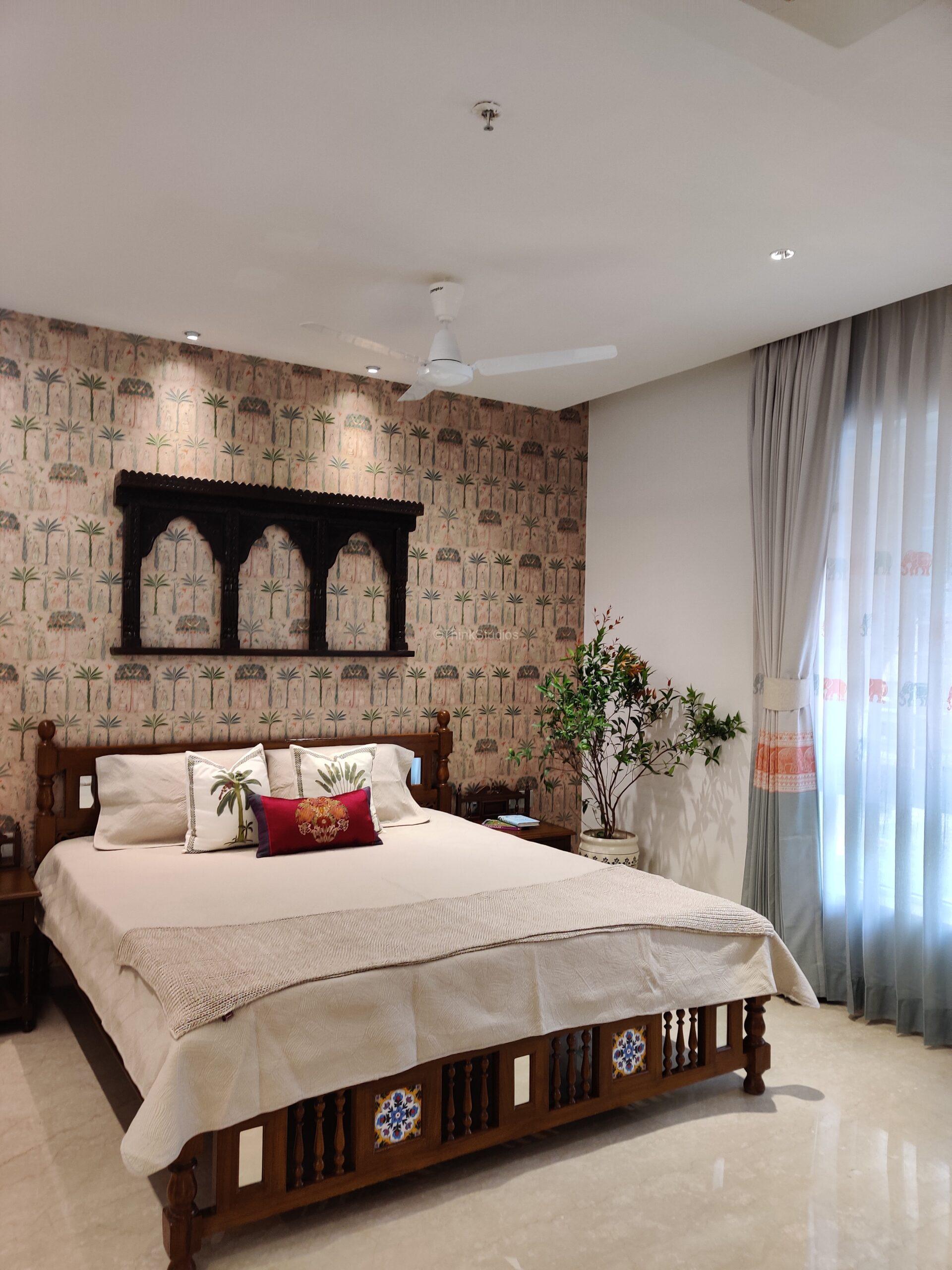 A Traditional Bedroom designed in dark, warm wood. Note the texture of the curtains and the plant adding life to the space.