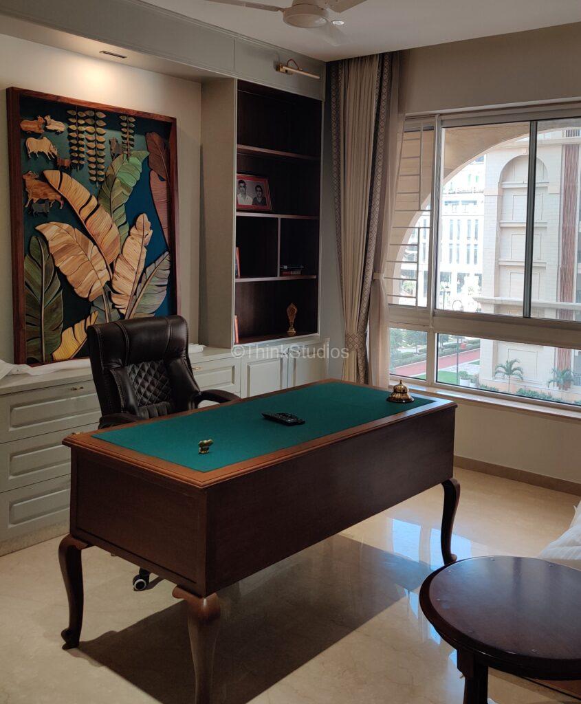 Rich, ornate traditional Indian home office space.